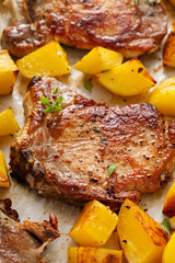 Pork chops and potatoes on a sheet pan oven roasted for an easy dinner