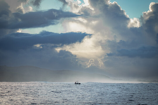 Solitary Boat in the Ocean &ndash; Storm Clouds over Mauritius