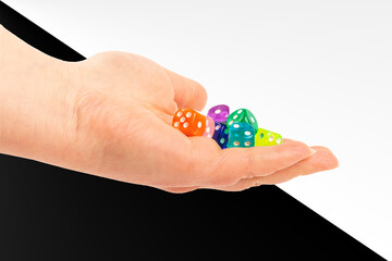 Colorful assortment of plastic dice held in an open hand during a tabletop game session