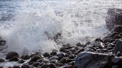 Ocean waves splashing on the shore of Madeira Island in Portugal