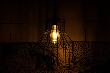 large yellow light bulb, iron grille, ceiling, decorative lantern, home, bright, shining, dark...