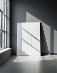 Blank canvas in sunlit minimalist room with geometric shadows, mockup