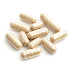 A scattered pile of beige capsules on a white background, showing medicine and health supplements