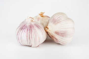 Garlic bulbs close up on a white background