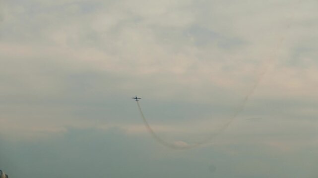 Aerobatic aircraft plane performs exciting aerobatic maneuvers at the aviation festival show