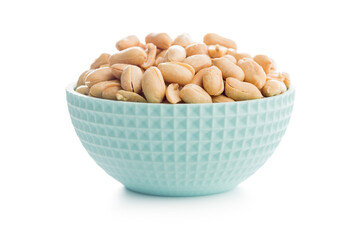 Roasted salted peanuts in bowl isolated on white background.