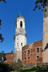 Obraz premium Vyborg, Russia - 08.25.24. Historic Clock Tower Against Blue Sky