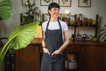 Portrait of japanese woman wear apron and stand in herbal workshop