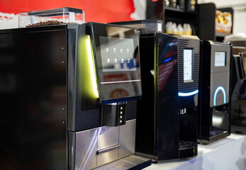 Professional coffee machines in a row with a touch interface
