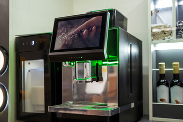 Self-service coffee vending machine with screen and milk cooler