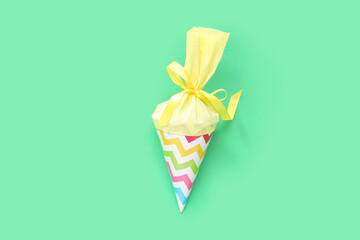 Yellow school cone on green background