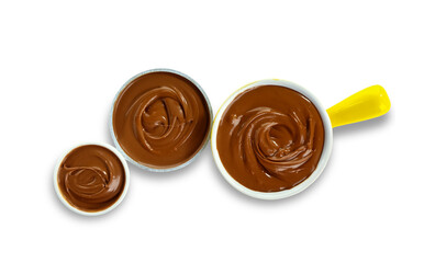 Bowls of sweet melted chocolate on white background