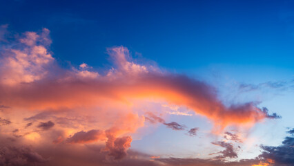 orange fluffy clouds in blue sky during sunset
