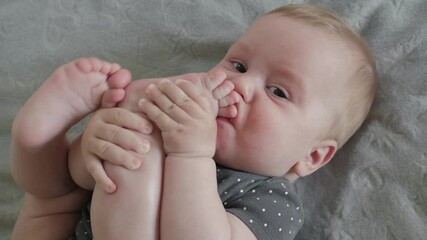 A joyful baby plays with its tiny, wiggly feet, displaying delightful expressions and curiosity, embodying the enchanting essence of innocent childhood filled with joy and wonder