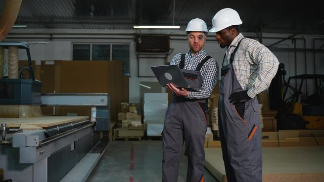 Engineers Oversee MDF Panel Cutting Process