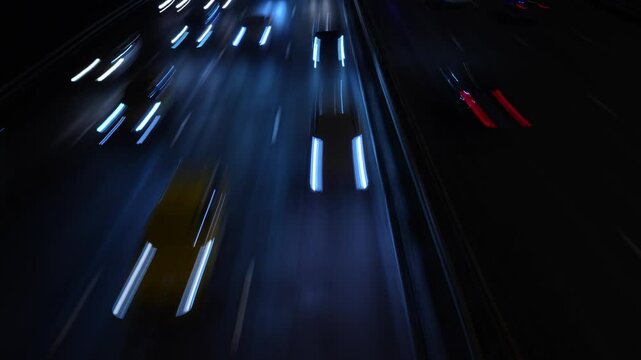 Сinematic shot of highway traffic at night, captured with a slow shutter speed