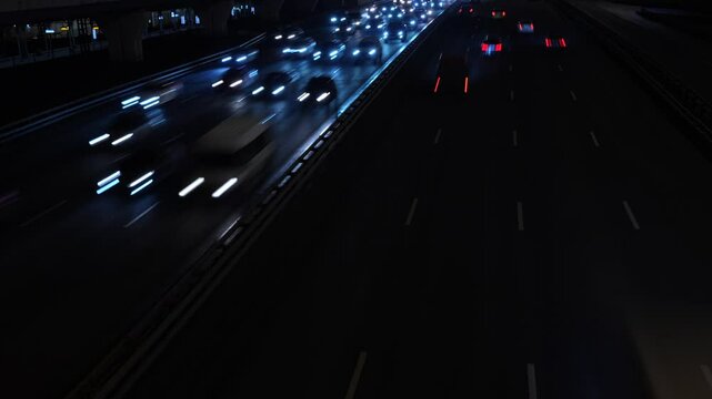 Сinematic shot of highway traffic at night, captured with a slow shutter speed