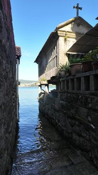Combarro, horreos and stone crosses overlooking peaceful water in galicia, spain
