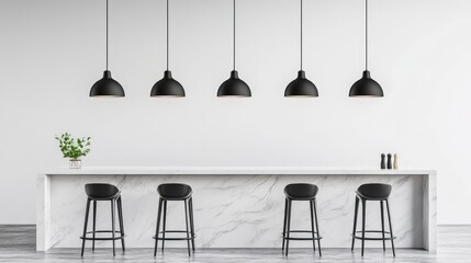 A row of sleek black pendant lights hanging over a minimalist marble kitchen island.