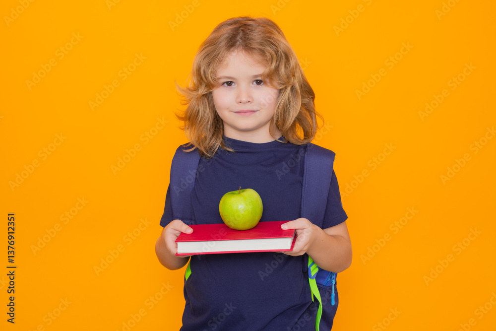 Poster child from elementary school with book and apple isolated on yellow background. little student, clev