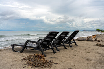 Sunbathing chair on the shore of a Colombian beach on the Atlantic Sea