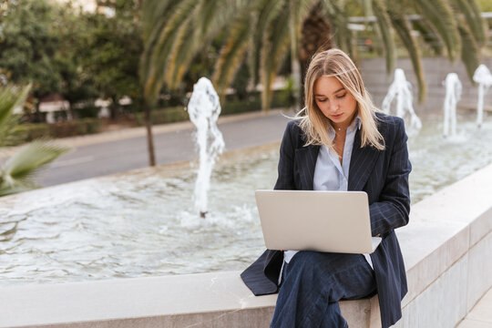 a woman using her laptop