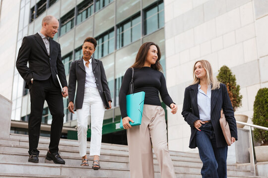 a diverse work group leaving the work day