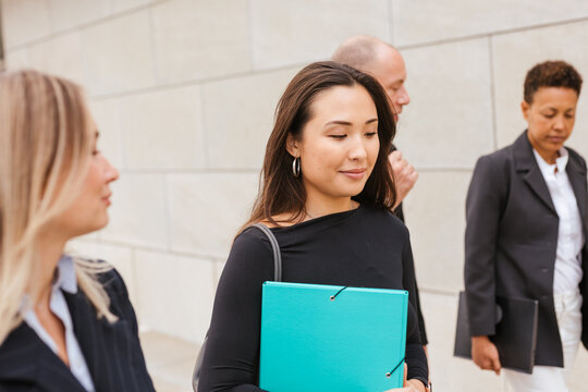 diverse work group leaving the office