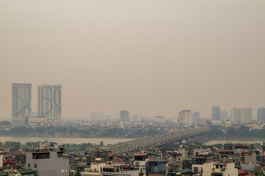 Long Bien Bridge and Hanoi Skyline Under Hazy Skies