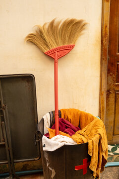 Rustic Broom in a Trash Bin