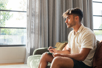 Contemplative young man noting ideas quietly