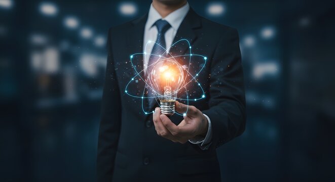 Holding Glowing Light Bulb with Atom Rings for Innovation Concept