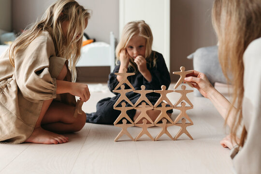 Creative Playtime With Wooden Figures and Sisters