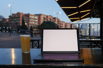 POV of Laptop and Beer in Toulouse Street Cafe
