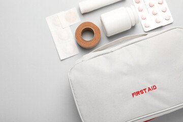 Flat lay composition with first aid kit on gray background