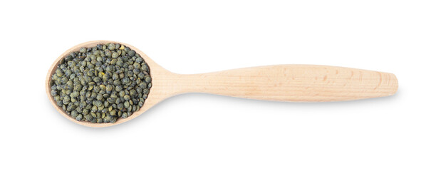 Raw lentils in wooden spoon isolated on white, top view