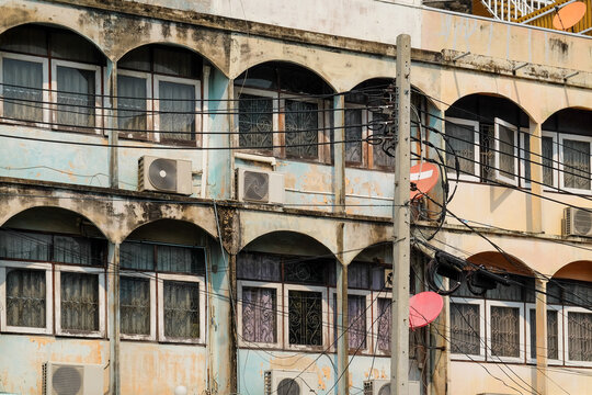 Weathered Building with Electrical Wires