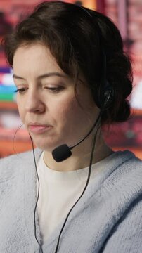 Vertical video Customer support workers assisting clients to meet outbound call quotas and sales targets. Call center agents contacting prospects to inform them about new products, camera A
