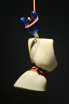 Suspended Foam Block Gripped by Multitool and Ropes