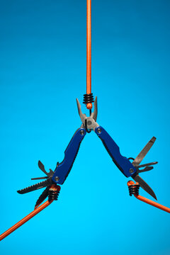Suspended Blue Multitool with Open Blades