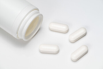 medicine bottle with white pills