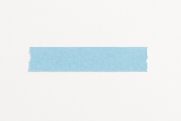 Single strip of light blue washi tape with torn edges on white background