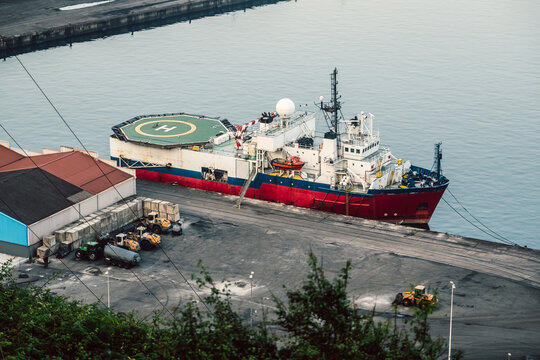 Offshore support vessel moored in a commercial port