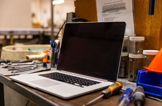 Blank screen laptop computer workplace