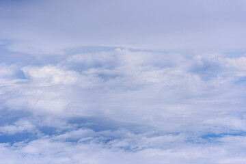White clouds, blue sky flying into Fiji