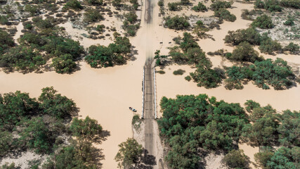 Drone shot the bridge above Eyre Creek at the entrance of  Bedourie, Diamantina Shire, channel...
