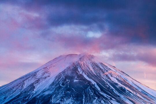 Snowcapped Fuji And Vibrant Dusk Clouds