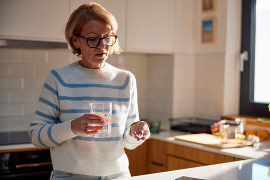 Woman taking the pill
