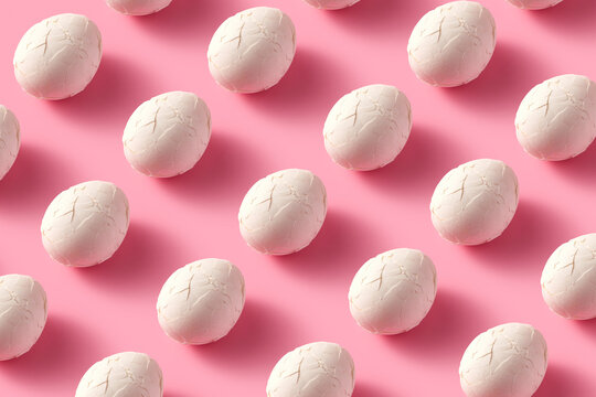 Pattern cracked eggs on pink background