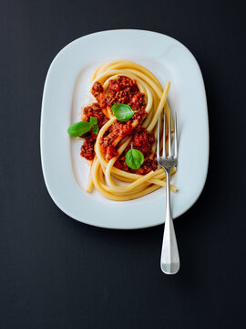 Delicious pasta Bolognese served with rich meat sauce and fresh basil